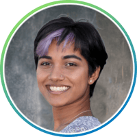 Nitya Baddam: Indian women with short hair with a purple streak in it