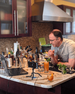 Jason, the host, in his kitchen speaking into the camera